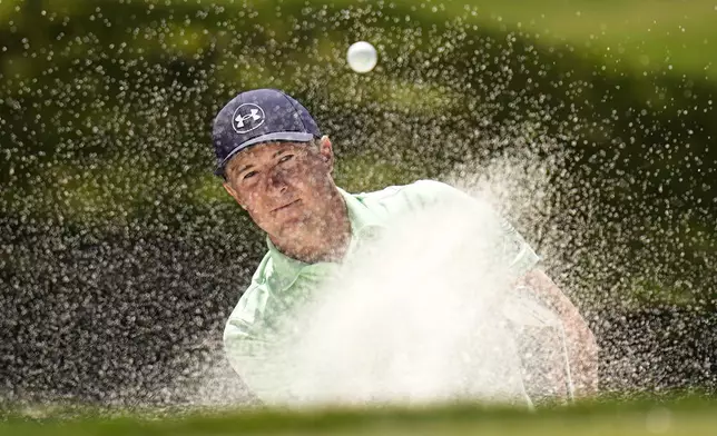 Jordan Spieth blasts out of a bunker on the eighth hole during the second round of the Texas Open golf tournament, Friday, April 5, 2024, in San Antonio. (AP Photo/Eric Gay)