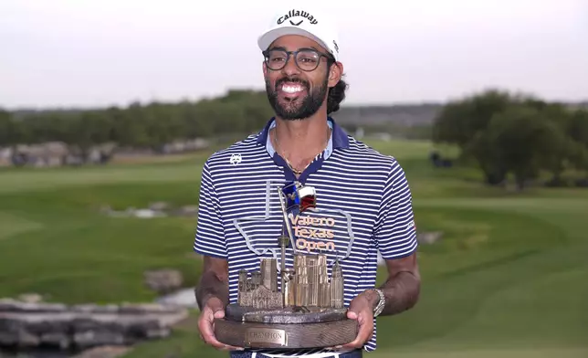 Akshay Bhatia holds his trophy after winning the Texas Open golf tournament, Sunday, April 7, 2024, in San Antonio. Bhatia defeated Denny McCarthy in a playoff. (AP Photo/Eric Gay)