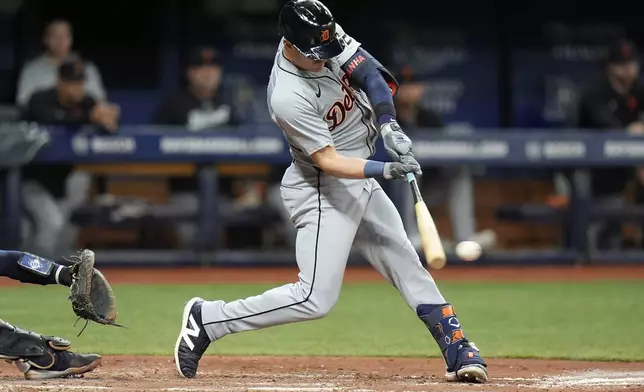Detroit Tigers' Mark Canha lines a two-run single off Tampa Bay Rays pitcher Tyler Alexander during the fifth inning of a baseball game Wednesday, April 24, 2024, in St. Petersburg, Fla. (AP Photo/Chris O'Meara)