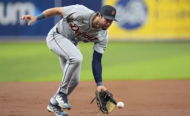 Detroit Tigers third baseman Matt Vierling fields a ground ball by Tampa Bay Rays' Isaac Paredes and throws him out at first base during the first inning of a baseball game Wednesday, April 24, 2024, in St. Petersburg, Fla. (AP Photo/Chris O'Meara)