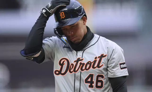 Detroit Tigers' Wenceel Pérez walks back to the dugout after striking out during the first inning of the team's baseball game against the Minnesota Twins, Friday, April 19, 2024, in Minneapolis. (AP Photo/Abbie Parr)