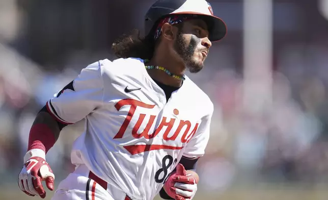 Minnesota Twins' Austin Martin runs the bases after hitting a solo home run during the ninth inning of a baseball game against the Detroit Tigers, Sunday, April 21, 2024, in Minneapolis. (AP Photo/Abbie Parr)