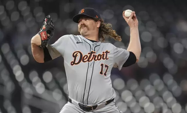 Detroit Tigers pitcher Andrew Chafin delivers during the eighth inning of the team's baseball game against the Minnesota Twins, Friday, April 19, 2024, in Minneapolis. (AP Photo/Abbie Parr)