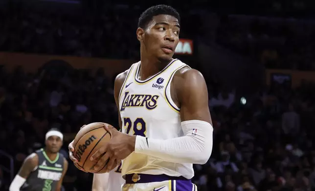Los Angeles Lakers forward Rui Hachimura (28) reacts after the Minnesota Timberwolves scored during the first half of an NBA basketball game, Sunday, April 7, 2024, in Los Angeles. (AP Photo/Etienne Laurent)