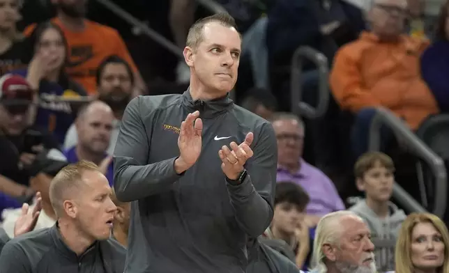 Phoenix Suns head coach Frank Vogel applauds his players during the first half of Game 4 of an NBA basketball first-round playoff series against the Minnesota Timberwolves, Sunday, April 28, 2024, in Phoenix. (AP Photo/Ross D. Franklin)
