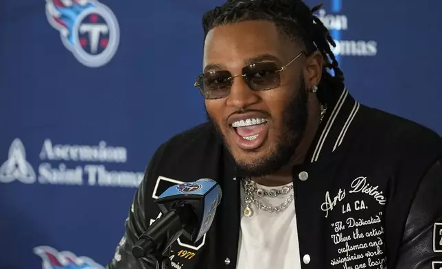 Tennessee Titans first round draft pick JC Latham speaks at an NFL football news conference Friday, April 26, 2024, in Nashville, Tenn. (AP Photo/George Walker IV)