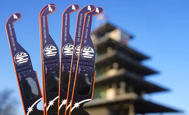 Eclipse glasses are shown at the Indianapolis Motor Speedway in Indianapolis, Monday, April 8, 2024. (AP Photo/Michael Conroy)