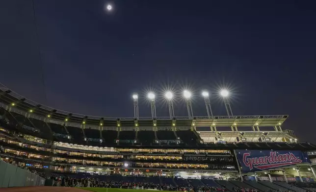 The moon covers the sun during a total solar eclipse at Progressive Field in Cleveland on Monday, April 8, 2024, before the Cleveland Guardians home opener baseball game. (AP Photo/Carolyn Kaster)