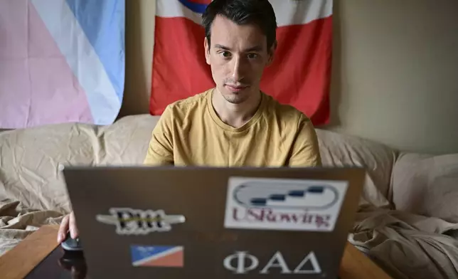 Amateur trader Manny Marotta looks at stock prices on his laptop in his apartment in Rocky River, Ohio, Wednesday, April 24, 2024. The legal writer from suburban Cleveland had been up about $4,000 on “put” options for Trump Media &amp; Technology stock, purchased over the past few weeks. (AP Photo/David Dermer)