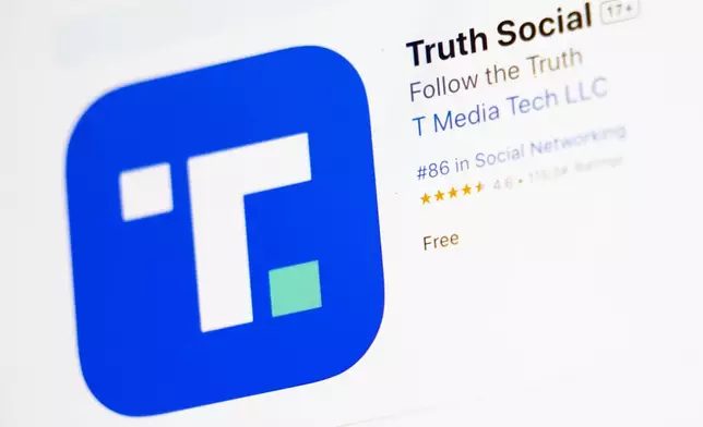 FILE = The download screen for Truth Social app is seen on a laptop computer, Wednesday, March 20, 2024, in New York. (AP Photo/John Minchillo, File)
