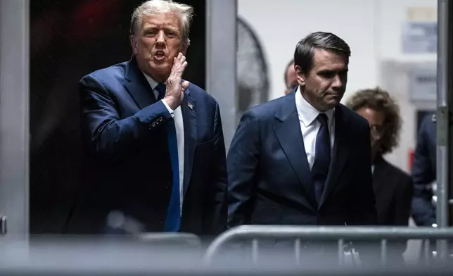 Former President Donald Trump speaks alongside attorney Todd Blanche as they return from a lunch break in his trial at Manhattan criminal court in New York on Thursday, April 18, 2024. (Jabin Botsford/The Washington Post via AP, Pool)