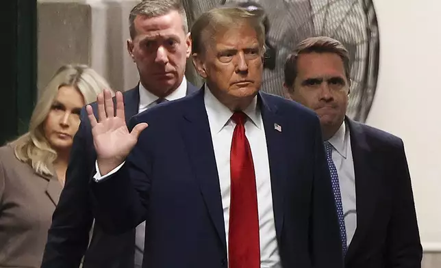 Former president Donald Trump returns to the courtroom after a recess in Manhattan criminal court, Tuesday, April 23, 2024, in New York. Trump is accused of falsifying internal business records as part of an alleged scheme to bury stories he thought might hurt his presidential campaign in 2016. (AP Photo/Yuki Iwamura, Pool)