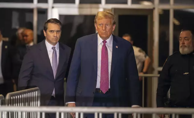 Former President Donald Trump, followed by his attorney Todd Blanche, left, exits the courtroom following proceedings in his trial, Friday, April 19, 2024, at Manhattan Criminal Court in New York. (Mark Peterson/Pool Photo via AP)