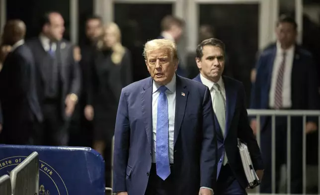 Former President Donald Trump, followed by his attorney Todd Blanche, exits the courtroom during his trial at Manhattan criminal court , Friday, April 26, 2024, in New York. (Curtis Means/DailyMail.com via AP)