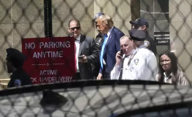 Former President Donald Trump, center, leaves Manhattan criminal court, Monday, April 22, 2024, in New York. Trump is accused of falsifying internal business records as part of an alleged scheme to bury stories he thought might hurt his presidential campaign in 2016. (AP Photo/Mary Altaffer)