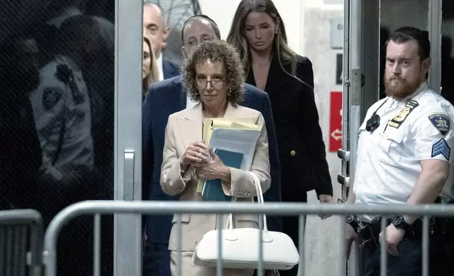 Susan Necheles, attorney for former President Donald Trump, returns from a break at Manhattan criminal court in New York, on Monday, April 15, 2024. The hush money trial of former President Trump begins Monday with jury selection. It's a singular moment for American history as the first criminal trial of a former U.S. commander in chief. (Jeenah Moon/Pool Photo via AP)
