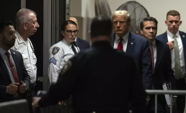 Former President Donald Trump, third right, at Manhattan criminal court in New York, on Monday, April 15, 2024. The hush money trial of Trump begun Monday with jury selection. (Jeenah Moon/Pool Photo via AP)