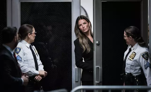 Margo Martin, center, arrives with former President Donald Trump speaks as he arrives at Manhattan criminal court with his legal team ahead of the start of jury selection in New York, Monday, April 15, 2024. (Jabin Botsford/The Washington Post via AP, Pool)Jabin Botsford/The Washington Post)