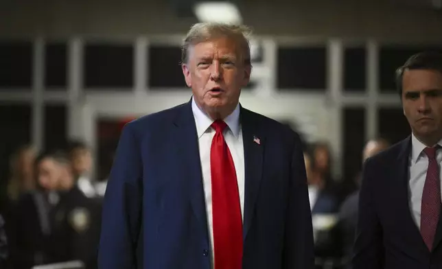 Former President Donald Trump speaks to the press in Manhattan state court in New York, Monday, April 15, 2024, after the first day of his trial over charges that he falsified business records to conceal money paid to silence porn star Stormy Daniels in 2016. (Angela Weiss/Pool Photo via AP)