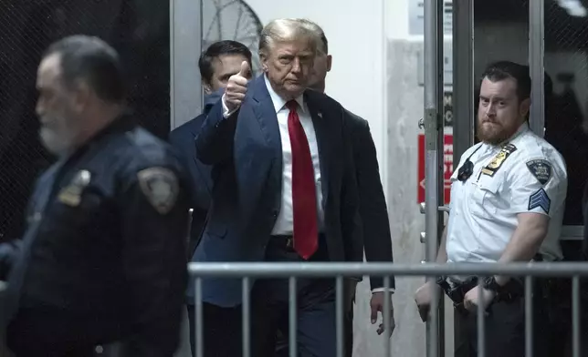 Former President Donald Trump returns from a break at Manhattan criminal court in New York on Monday, April 15, 2024. The hush money trial of former President Trump begins Monday with jury selection. It's a singular moment for American history as the first criminal trial of a former U.S. commander in chief. (Jeenah Moon/Pool Photo via AP)
