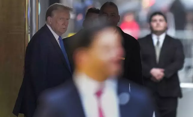 Former president Donald Trump leaves Trump Tower on his way to Manhattan criminal court, Thursday, April 18, 2024, in New York. Jury selection in Donald Trump's hush money trial enters a pivotal phase as the former president returns to court. Attorneys still need to pick 11 more jurors to serve on the panel that will decide the first-ever criminal case against a former U.S. commander-in-chief. (AP Photo/Seth Wenig)
