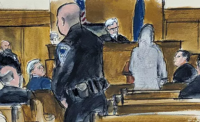 Former President Donald Trump, second from left, watches juror number d2 speak at the podium to Judge Juan Merchan in Manhattan criminal court regarding her desire to be excused from the jury after " sleeping on it" and having concerns about her ability to be fair and impartial, Thursday, April 18, 2024, in New York. (Elizabeth Williams via AP, Pool)