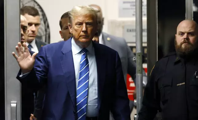 Former President Donald Trump returns to the courtroom after a break in the second day of jury selection at Manhattan criminal court, Tuesday, April 16, 2024, in New York. Trump returned to the courtroom Tuesday as a judge works to find a panel of jurors who will decide whether the former president is guilty of criminal charges alleging he falsified business records to cover up a sex scandal during the 2016 campaign. (Michael M. Santiago/Pool Photo via AP)