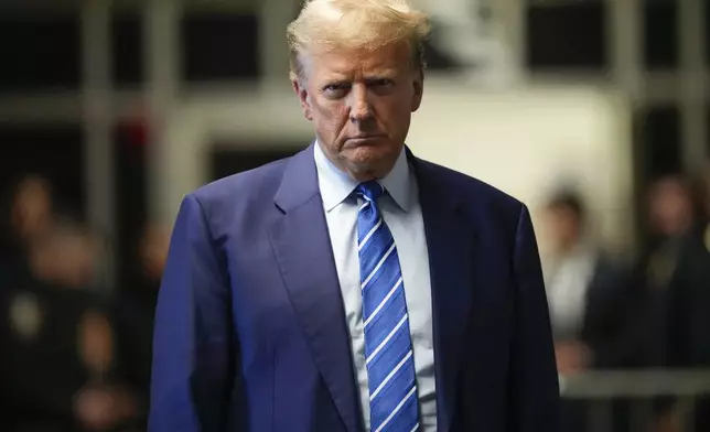 Former President Donald Trump speaks to reporters as he leaves a Manhattan courtroom after the second day of his criminal trial, Tuesday, April 16, 2024 in New York. (AP Photo/Mary Altaffer, Pool)
