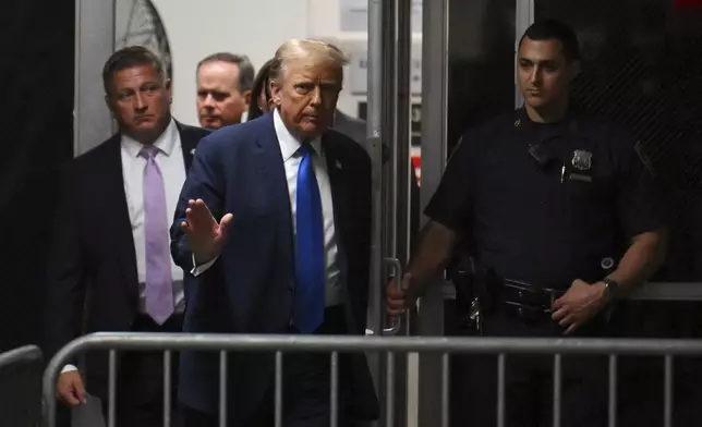 Former U.S. President and Republican presidential candidate Donald Trump returns to the courtroom after a break at Manhattan criminal court during his trial in New York, on Monday, April 22, 2024. Opening statements in Trump's historic hush money trial began Monday. Trump is accused of falsifying internal business records as part of an alleged scheme to bury stories he thought might hurt his presidential campaign in 2016. (Angela Weiss/Pool Photo via AP)