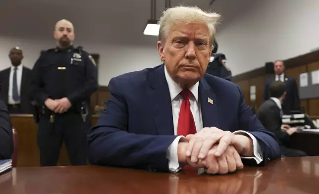 Former president Donald Trump waits for the start of proceedings in Manhattan criminal court, Tuesday, April 23, 2024, in New York. Before testimony resumes Tuesday, the judge will hold a hearing on prosecutors' request to sanction and fine Trump over social media posts they say violate a gag order prohibiting him from attacking key witnesses. (AP Photo/Yuki Iwamura, Pool)