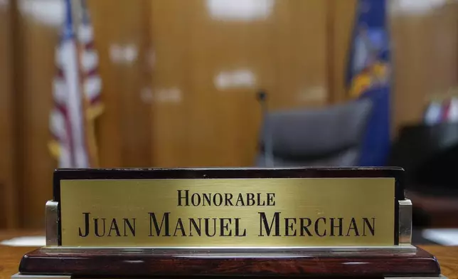 Judge Juan Merchan's name plate sits on the bench in his Manhattan criminal courtroom, Tuesday, March 12, 2024 in New York. A dozen Manhattan residents are soon to become the first Americans ever to sit in judgment of a former president charged with a crime. Jury selection is set to start Monday in former President Donald Trump's hush-money trial. (AP Photo/Seth Wenig)