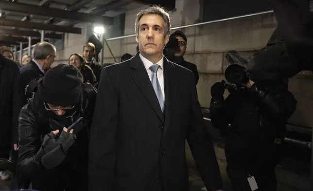 FILE - Michael Cohen, former attorney to Donald Trump, leaves the District Attorney's office in New York, March 13, 2023. Trump is set to stand trial Monday, April 15, 2024, in New York on state charges related to the very sex scandal that he and his aides strove to hide. Many details of the case have been public since 2018, when federal prosecutors charged Cohen with campaign finance crimes in connection with a scheme to bury Stormy Daniels' claims, and other potentially damaging stories from Trump's playboy past. (AP Photo/Yuki Iwamura, File)