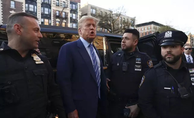 Former president Donald Trump, comments after visiting a bodega, Tuesday, April 16, 2024, who's owner was attacked last year in New York. Fresh from a Manhattan courtroom, Donald Trump visited a New York bodega where a man was stabbed to death, a stark pivot for the former president as he juggles being a criminal defendant and the Republican challenger intent on blaming President Joe Biden for crime. Alba's attorney, Rich Cardinale, second from left, and Fransisco Marte, president of the Bodega Association, looked on. (AP Photo/Yuki Iwamura)