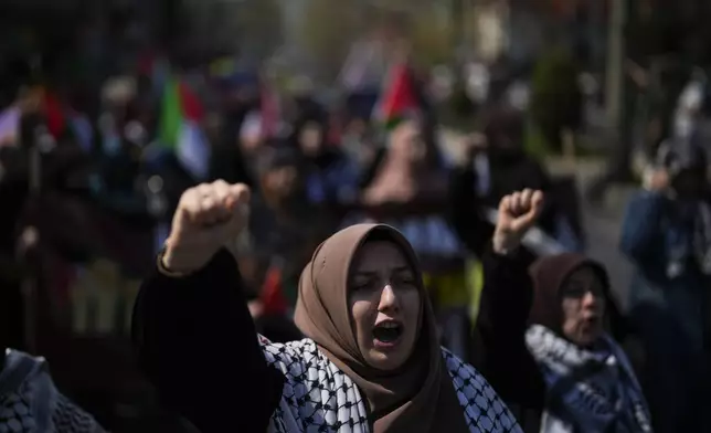 Supporters of Palestinians in Gaza protest in Istanbul, Turkey, Friday, April 5, 2024. (AP Photo/Khalil Hamra)