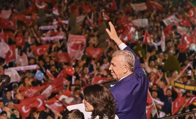 Ankara's Mayor and Republican People's Party, or CHP, candidate Mansur Yavas gestures to supporters, in Ankara, Turkey, Sunday, March 31, 2024. (AP Photo/Ali Unal)