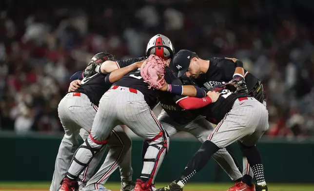 Minnesota Twins celebrate a win over the Los Angeles Angels in a baseball game Saturday, April 27, 2024, in Anaheim, Calif. (AP Photo/Ryan Sun)