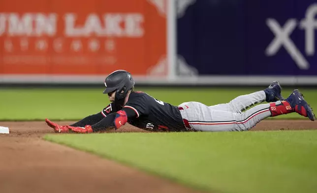 Minnesota Twins' Ryan Jeffers slides into second base after hitting a double against the Baltimore Orioles during the sixth inning of a baseball game Tuesday, April 16, 2024, in Baltimore. (AP Photo/Jess Rapfogel)