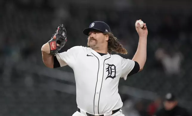 Detroit Tigers pitcher Andrew Chafin throws during the eighth inning of a baseball game against the Minnesota Twins, Friday, April 12, 2024, in Detroit. (AP Photo/Carlos Osorio)