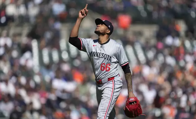 Minnesota Twins pitcher Jorge Alcala (66) celebrates the final out against the Detroit Tigers in the 10th inning during the first baseball game of a doubleheader, Saturday, April 13, 2024, in Detroit. (AP Photo/Paul Sancya)
