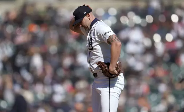 Detroit Tigers pitcher Alex Lange (55) reacts after walking in a run against the Minnesota Twins in the 12th inning during the first baseball game of a doubleheader, Saturday, April 13, 2024, in Detroit. (AP Photo/Paul Sancya)
