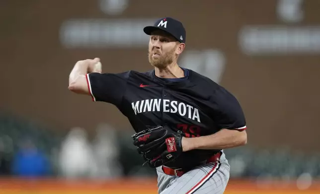 Minnesota Twins pitcher Michael Tonkin throws during the seventh inning of a baseball game against the Detroit Tigers, Friday, April 12, 2024, in Detroit. (AP Photo/Carlos Osorio)