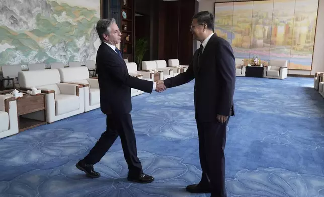 U.S. Secretary of State Antony Blinken, left, shakes hans with Shanghai Party Secretary Chen Jining as they meet at the Grand Halls, Thursday, April 25, 2024, in Shanghai, China. (AP Photo/Mark Schiefelbein, Pool)