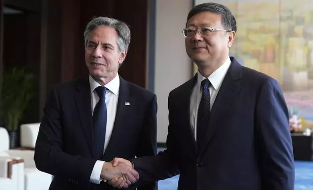 U.S. Secretary of State Antony Blinken, left, meets with Shanghai Party Secretary Chen Jining at the Grand Halls, Thursday, April 25, 2024, in Shanghai, China. (AP Photo/Mark Schiefelbein, Pool)