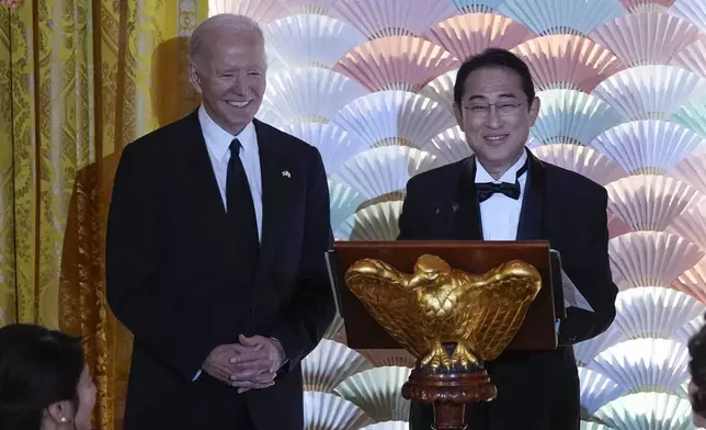 President Joe Biden listens as Japanese Prime Minister Fumio Kishida speaks ahead of a toast during a State Dinner at the White House, Wednesday, April 10, 2024, in Washington. (AP Photo/Evan Vucci)