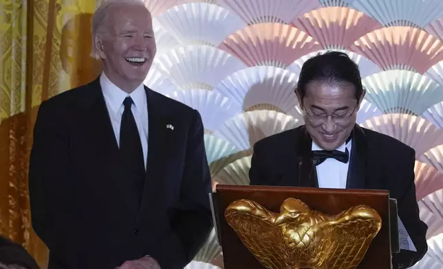 President Joe Biden listens as Japanese Prime Minister Fumio Kishida speaks ahead of a toast during a State Dinner at the White House, Wednesday, April 10, 2024, in Washington. (AP Photo/Evan Vucci)