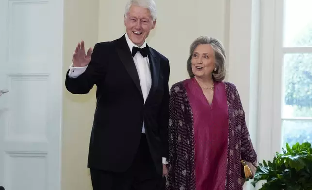 Former President Bill Clinton and former Secretary of State Hillary Rodham Clinton, arrive at the Booksellers area of the White House for the State Dinner hosted by President Joe Biden and first lady Jill Biden for Japan's Prime Minister Fumio Kishida, and wife Kishida Yuko, Wednesday, April 10, 2024, in Washington. (AP Photo/Jacquelyn Martin)