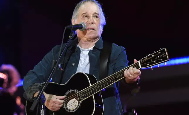 FILE - Paul Simon performs at Global Citizen Live in Central Park in New York on Sept. 25, 2021. Simon will sing for guests at Wednesday's White House state dinner for Japan. The White House says he's one of first lady Jill Biden's favorite musicians. (Photo by Evan Agostini/Invision/AP, File)