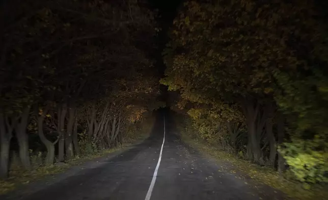 A main road leads to the frontline in the Sloviansk region, Ukraine, Wednesday, Oct. 25, 2023. (AP Photo/Bram Janssen)