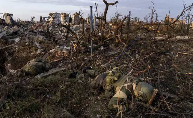 FILE - The bodies of Russian soldiers lie at the frontline in Andriivka, Donetsk region, Ukraine, Saturday, Sept. 16, 2023. (AP Photo/Mstyslav Chernov, File)