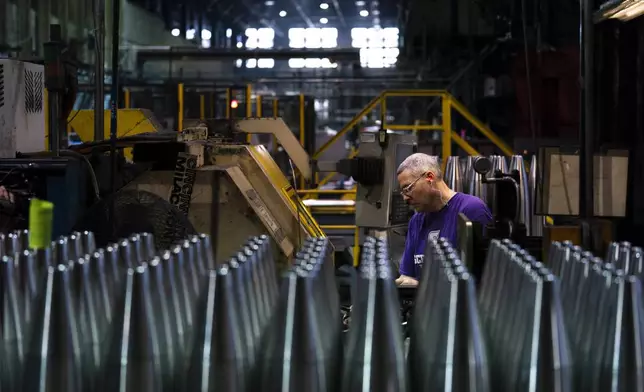 FILE - A steel worker manufactures 155 mm M795 artillery projectiles at the Scranton Army Ammunition Plant in Scranton, Pa., Thursday, April 13, 2023. The Pentagon could get weapons moving to Ukraine within days if Congress passes a long-delayed aid bill. That's because it has a network of storage sites in the U.S. and Europe that already hold the ammunition and air defense components that Kyiv desperately needs. The House approved $61 billion in funding for the war-torn country Saturday, April 20, 2024. (AP Photo/Matt Rourke, File)